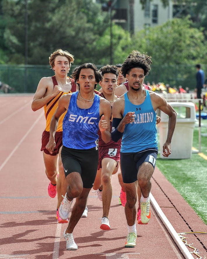 James Jimenez passes other runners in a track meet.